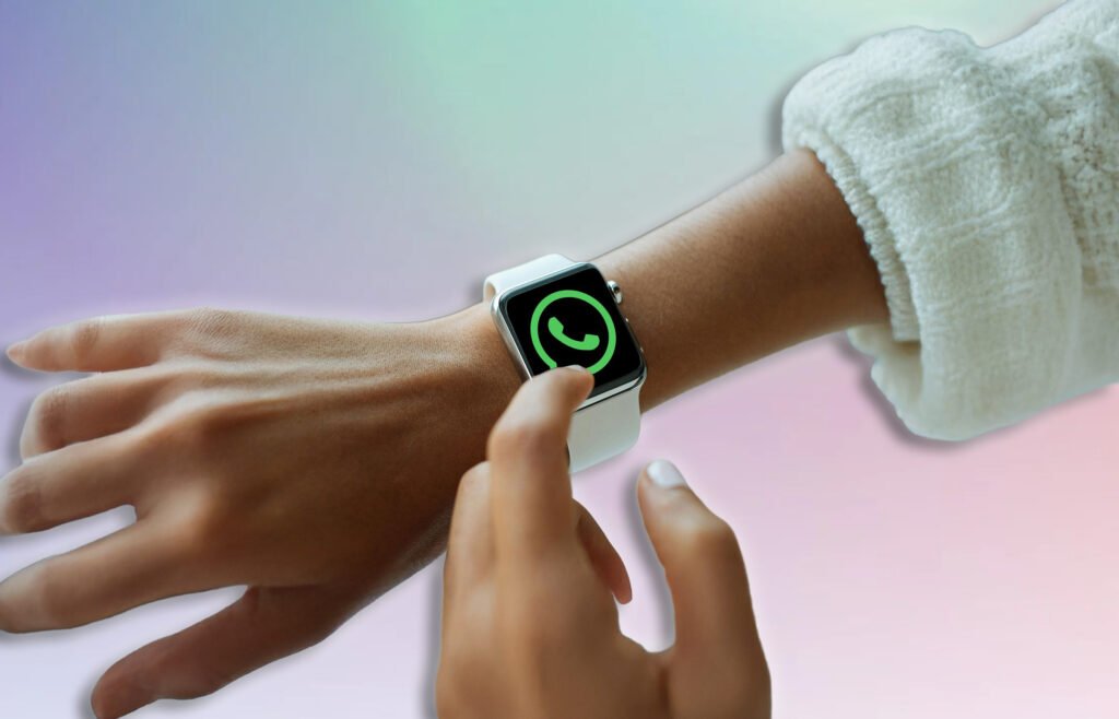 WhatsApp on Apple Watch: Now with messaging and Voice Notes A person wearing a white smartwatch on their wrist, displaying a green phone call icon on the screen, against a gradient background.