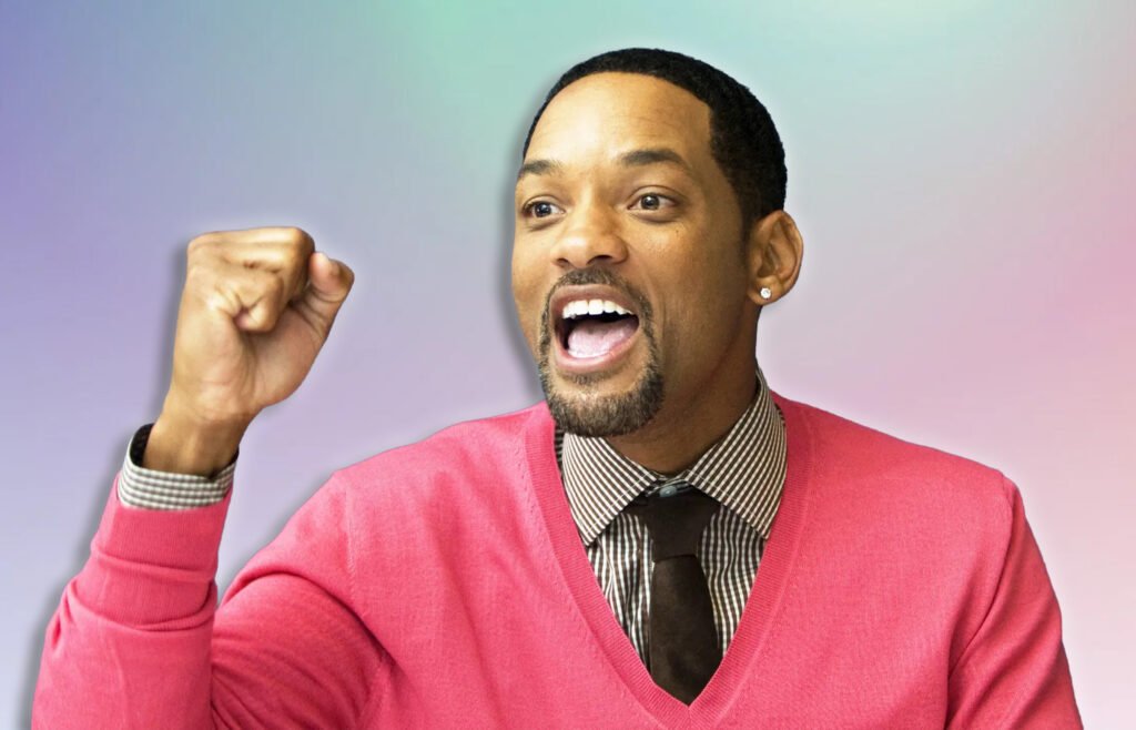 A person wearing a pink sweater, striped shirt, and black tie, with an expressive pose and a fist raised, set against a gradient background.