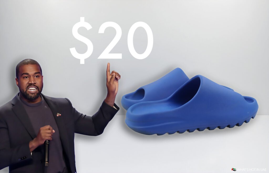 Kanye West Yeezy Slides: The $20 Revolution That’s Redefining Streetwear A person holding a microphone is pointing towards a $20 sign next to a pair of blue slides on a light background.