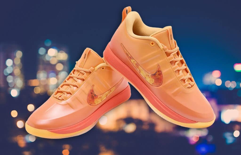Peach-colored sneakers with a marbled Nike swoosh, set against a blurred city lights background.
