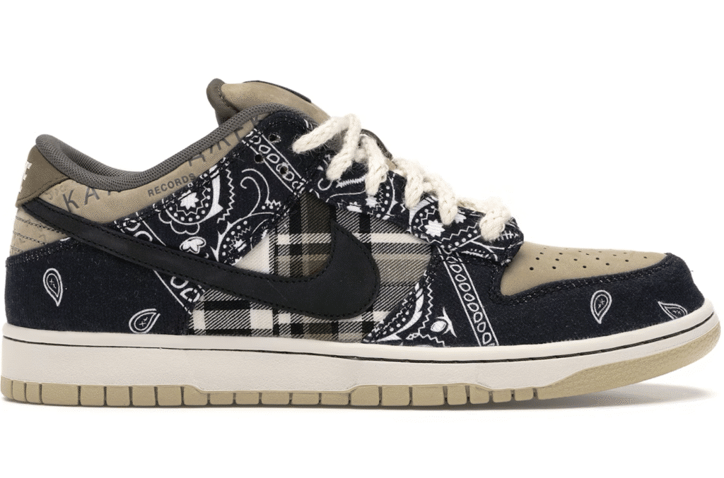 A sneaker with a beige and navy color scheme, featuring paisley and plaid patterns, a black swoosh logo, and rope-like white laces.