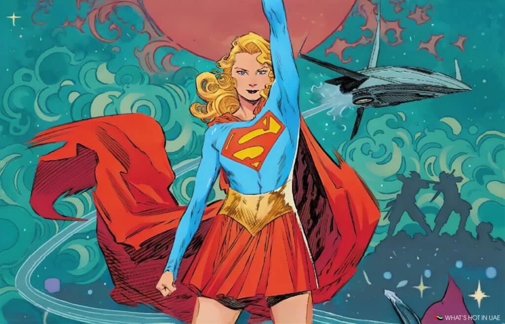 A comic-style illustration of a superhero in a blue top with a red 'S' emblem, a red skirt, and a flowing red cape, standing triumphantly with one fist raised. The background features swirling green and blue patterns, a flying spaceship, and silhouette figures in a dynamic pose.