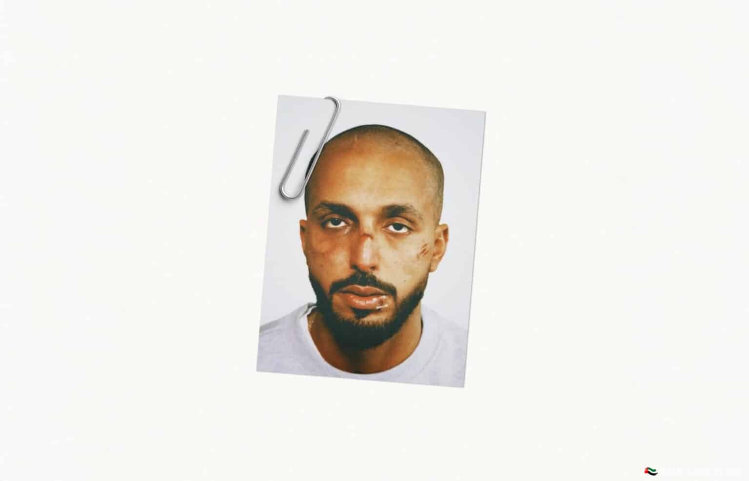 A photo of a man with a neutral expression, clipped to a white background.