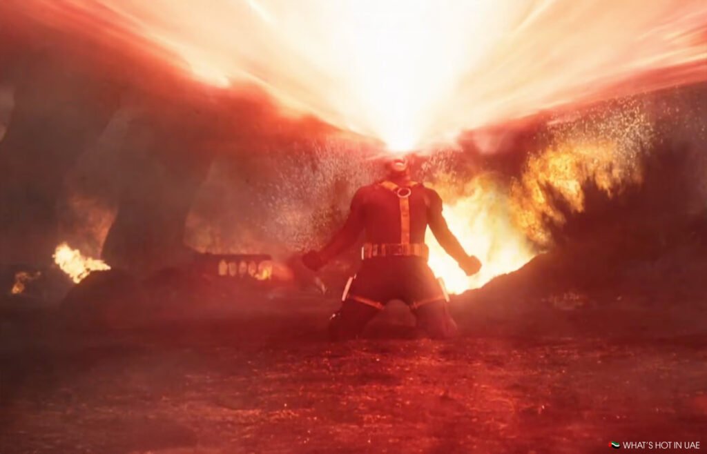 Cyclops kneels on the ground, unleashing a powerful beam of energy from his eyes in a fiery environment as the X-Men return to our screens. 