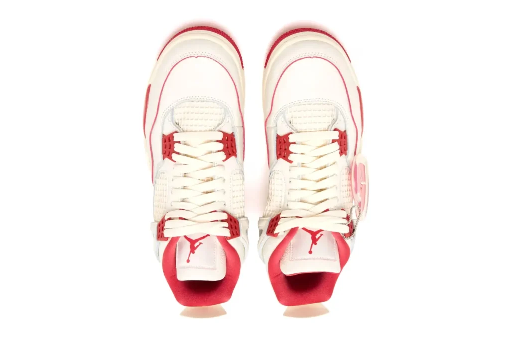 Red and white sneakers viewed from above, featuring red logos and accents.