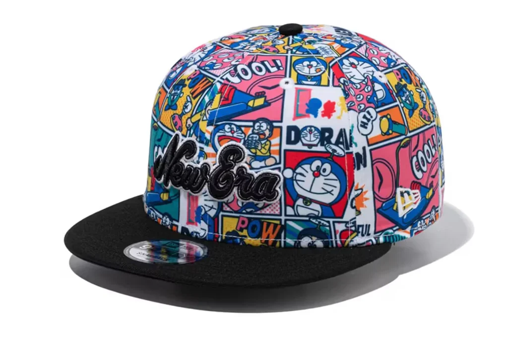 A colorful New Era cap featuring cartoon graphics and a black brim.
