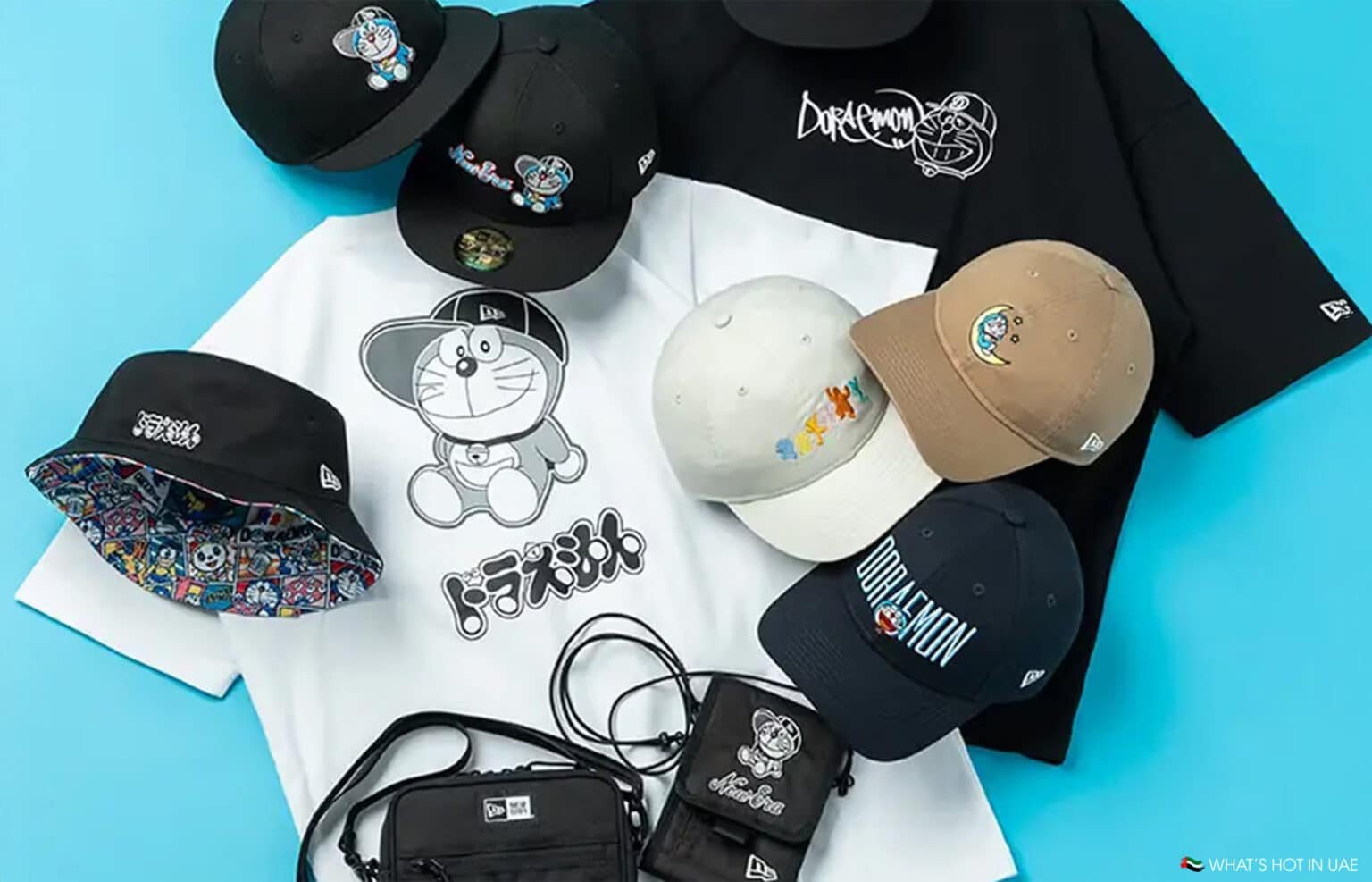 A collection of shirts and caps featuring cartoon designs and logos, arranged on a blue background.