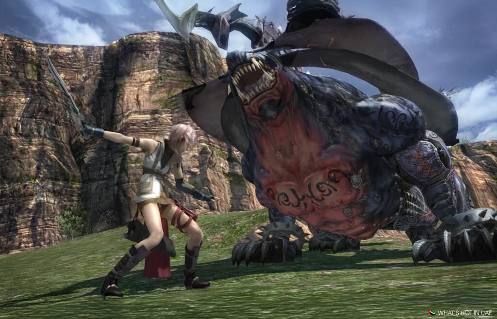 A warrior wielding a sword confronts a large, menacing creature with sharp teeth on a grassy landscape.