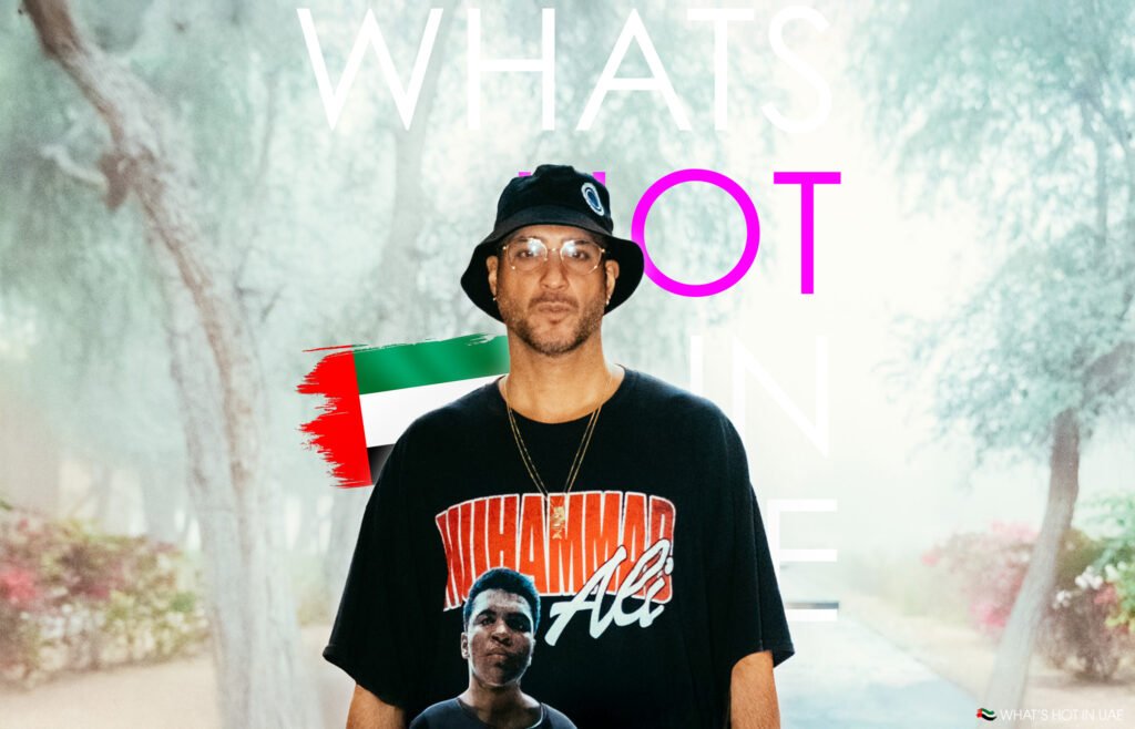 Loco Dice in Dubai in a bucket hat wearing a Muhammad Ali t-shirt, with the UAE flag and "WHAT'S HOT IN UAE" text in the background.