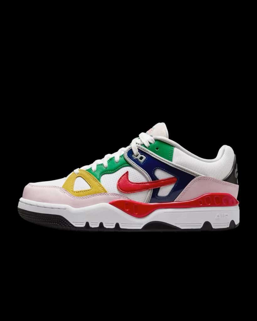 Colorful sneaker with red, yellow, green, and blue panels, featuring a prominent red Nike swoosh on the side.