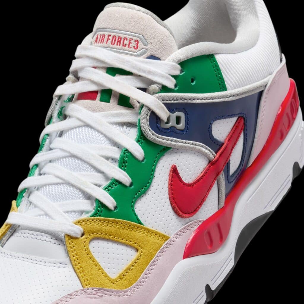 A colourful Nike x Nigo Air Force 3 sneaker featuring a red Nike swoosh, with green, yellow, blue, and pink accents on a white base.