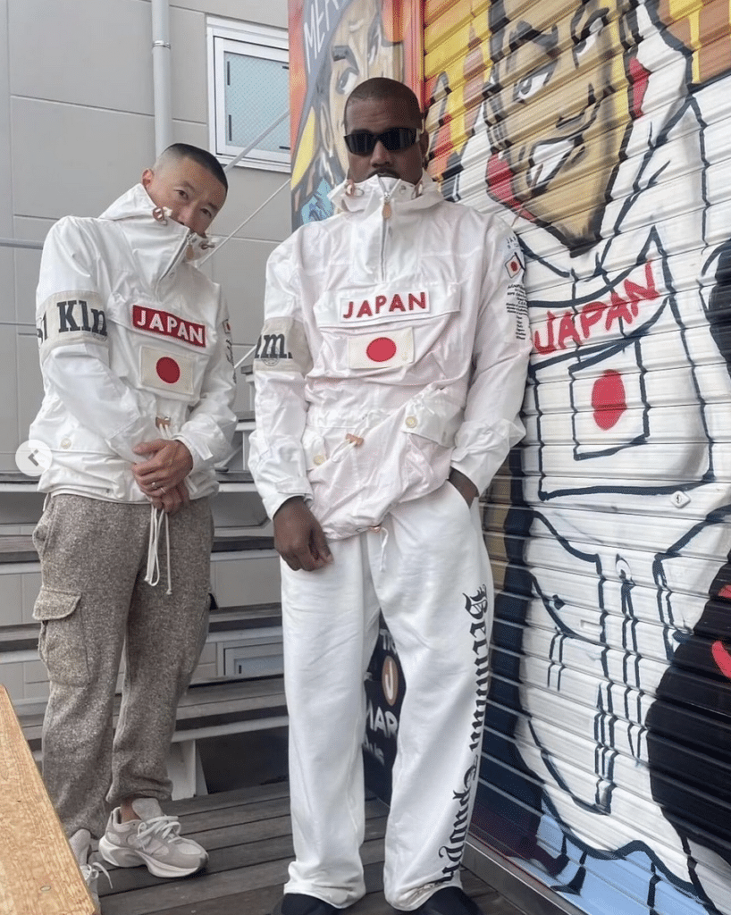 Two people standing in front of a mural, wearing Polo Ralph Lauren x BEAMS JAPANORAK with "JAPAN" across the chest and the Japanese flag.