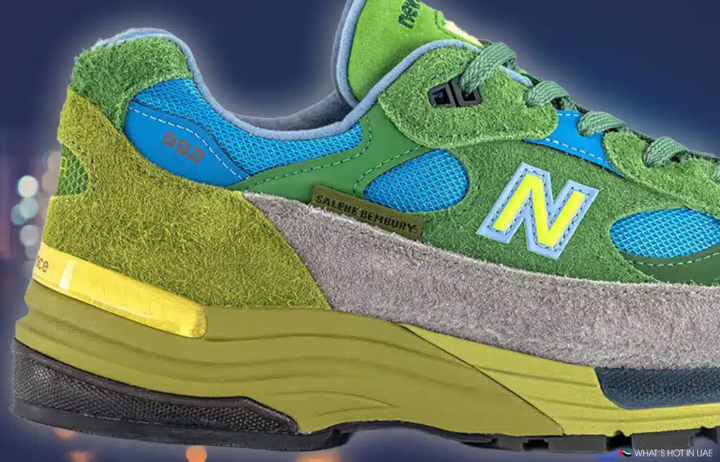Colorful Salehe Bembury x New Balance 992 sneaker with green, blue, and gray panels, featuring a prominent yellow "N" logo and "Salehe Bembury" name on the side.