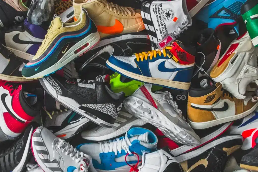 Sneaker Culture in the UAE: Beyond Hype, Towards Enduring Elegance A pile of colorful sneakers with various designs and logos.