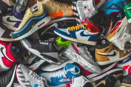 A pile of colorful sneakers with various designs and logos.