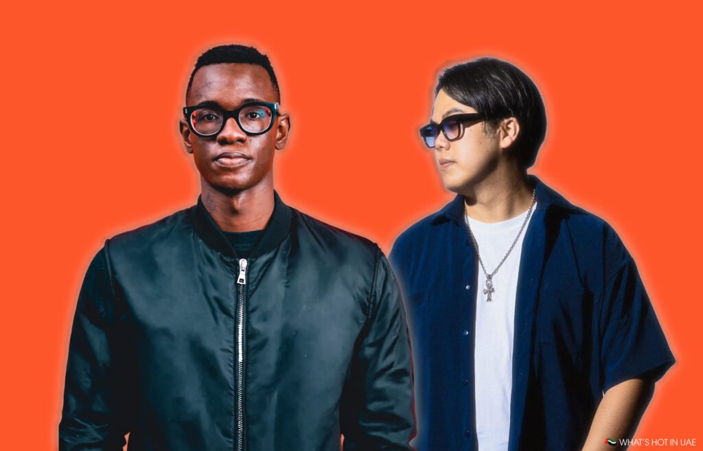 Bohemia Presents Alex Wann & SONA wearing sunglasses, one in a bomber jacket, the other with a necklace, against a bright orange background.