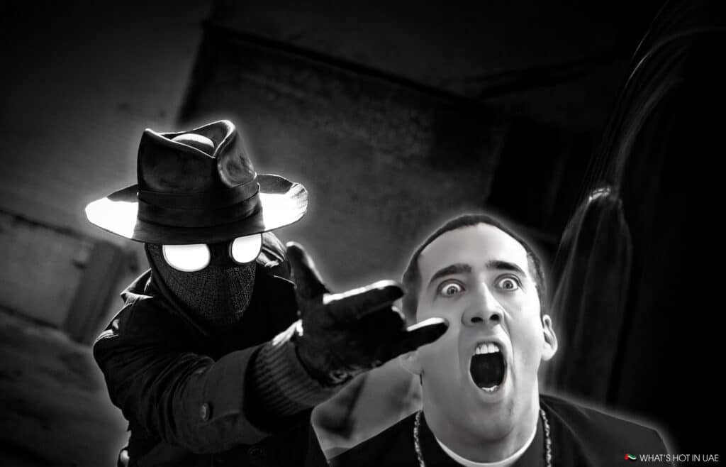 A mysterious figure in a hat and trench coat points forward, while a surprised man appears in the background.