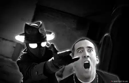 A mysterious figure in a hat and trench coat points forward, while a surprised man appears in the background.