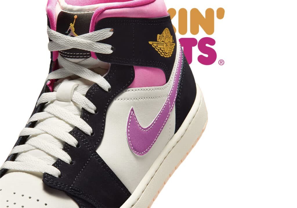 A close-up of a colorful sneaker with a pink, black, and white design, featuring a gold emblem and purple Nike swoosh.