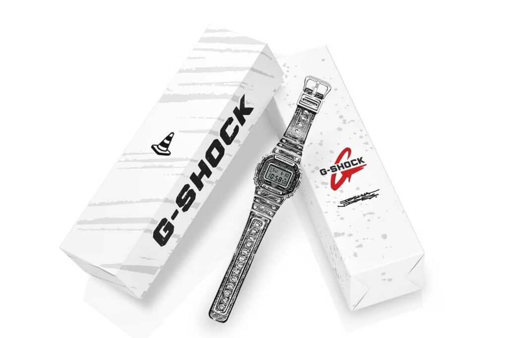 A patterned G-Shock watch is displayed next to its branded packaging against a white background.
