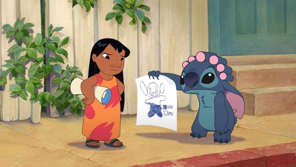 A cartoon girl looks annoyed as a blue alien holds up a drawing of itself in Lilo & Stitch 2.