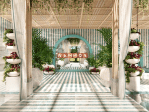 A decorative space with a striped blue and white theme, featuring lush greenery, potted plants, and "Nammos" text on an arched sign.