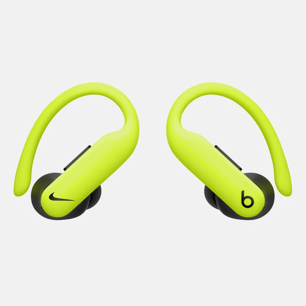 Bright yellow wireless Powerbeats Pro 2 earbuds with hooks, featuring a Nike logo on one earbud and a Beats logo on the other.