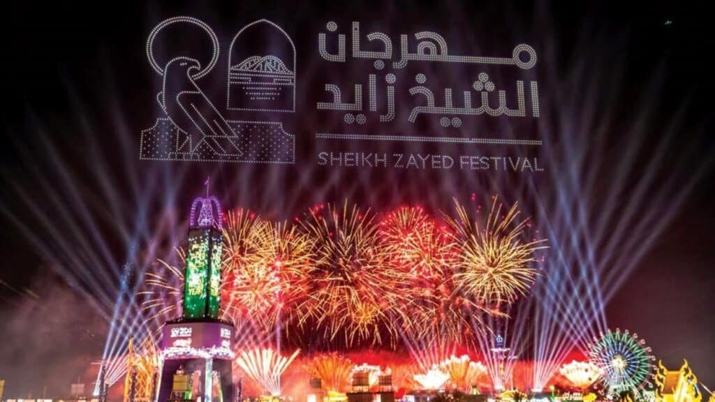Abu Dhabi March Events: Colourful fireworks and light beams illuminate the sky at the Sheikh Zayed Festival, with a logo displayed above.