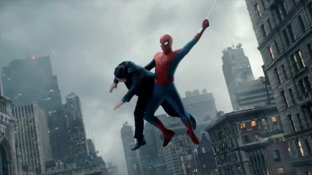 Spider-Man swings through a city skyline, holding a person in a suit.