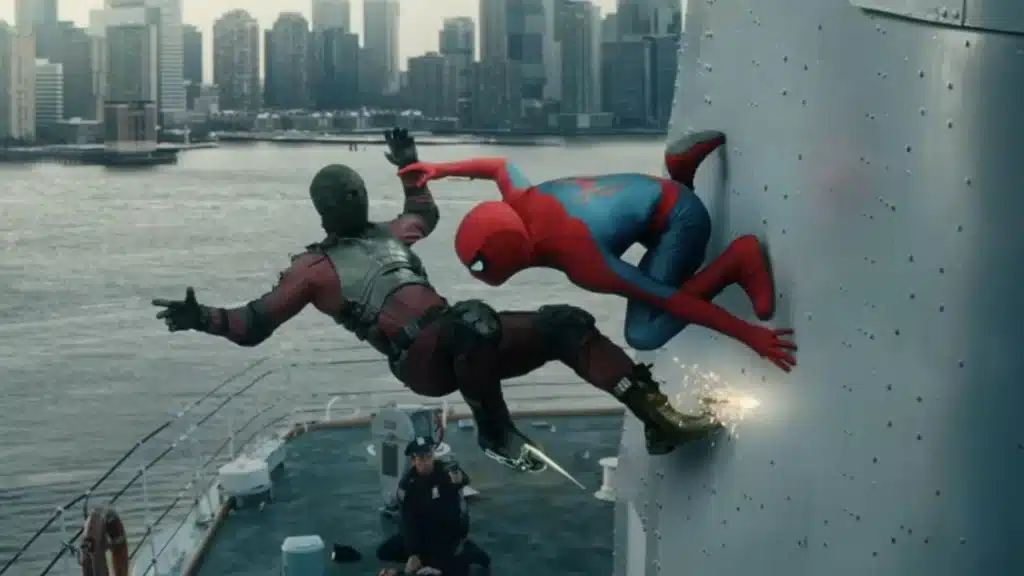 A superhero in a red and black suit battles another in a red and blue suit on the side of a ferry, with a city skyline in the background.