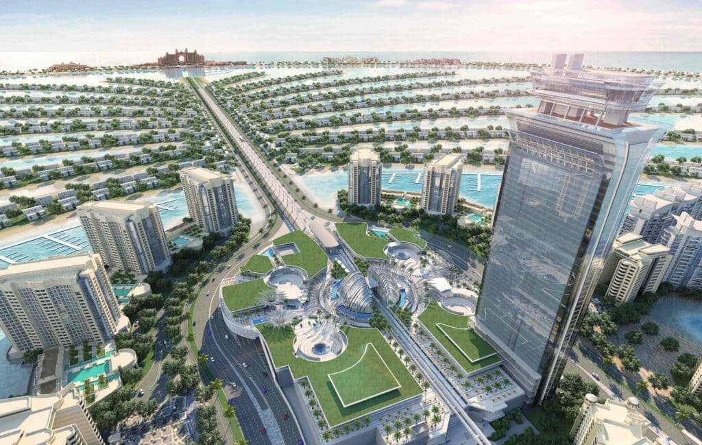 Aerial view of a modern city with a distinctive palm-shaped island and high-rise buildings, connected by bridges and surrounded by water.