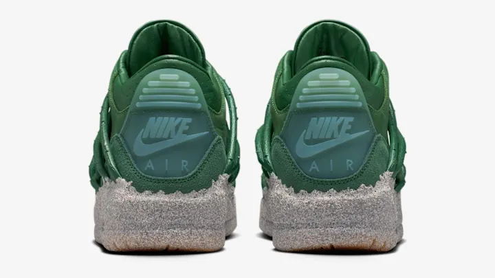 A pair of green Teyana Taylor x Air Jordan 3 sneakers with a Nike logo and "AIR" text on the heel, featuring a textured gray sole.