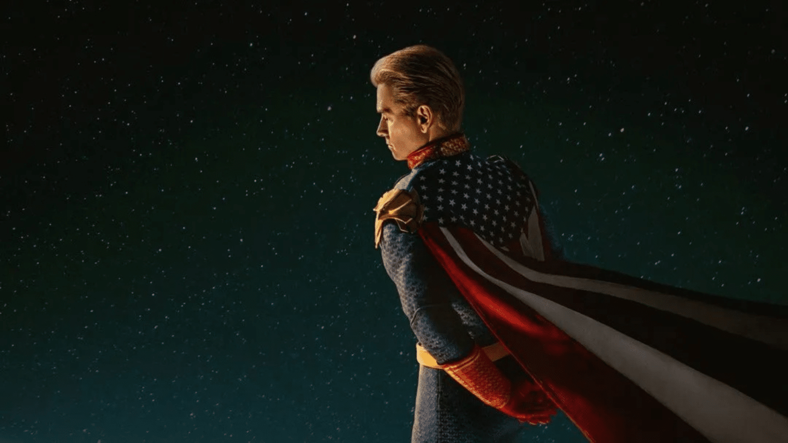 A superhero in a star-spangled suit and cape stands against a starry night sky.