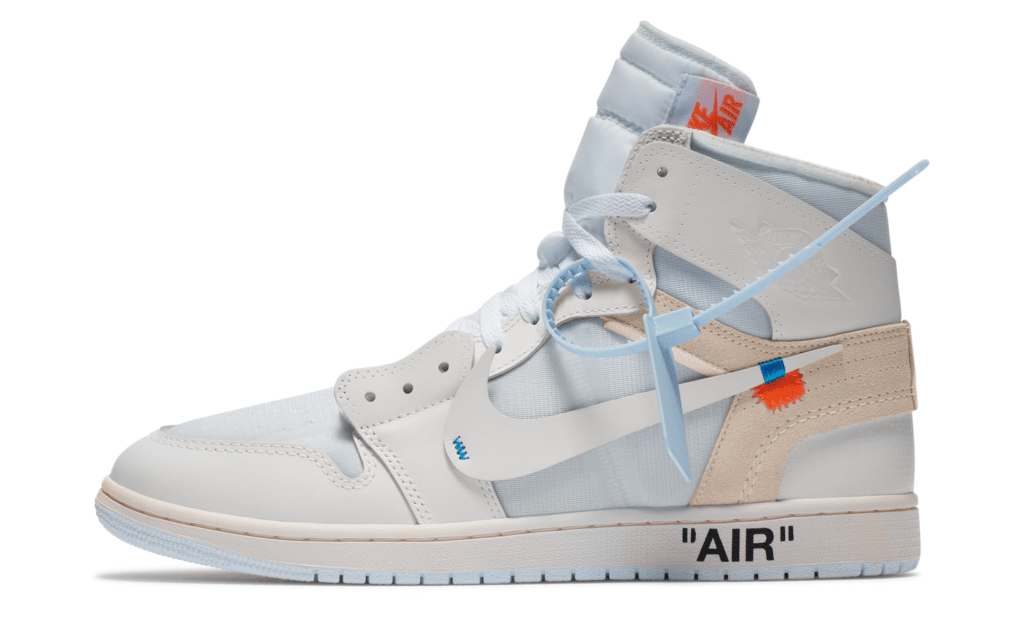 A white Air Jordan 1 'Alaska' high-top sneaker with blue and beige accents, featuring a deconstructed design and "AIR" text on the sole.