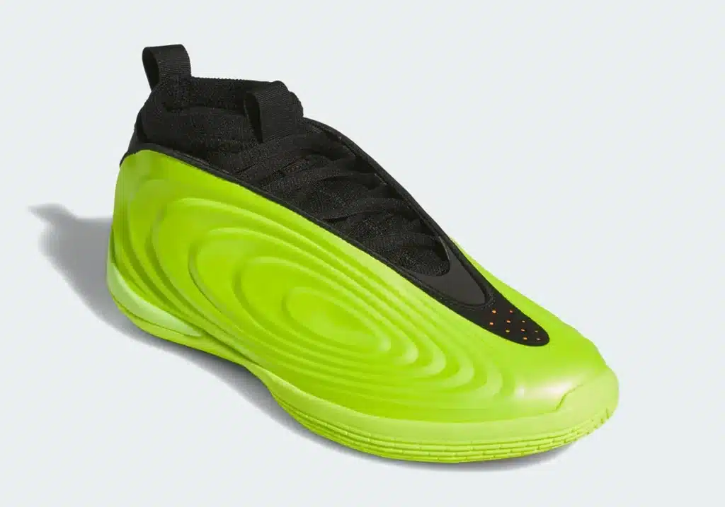 A bright Adidas Harden Vol. 10 “Hi-Res Yellow” sneaker with a black lace area and textured wave design on the side.