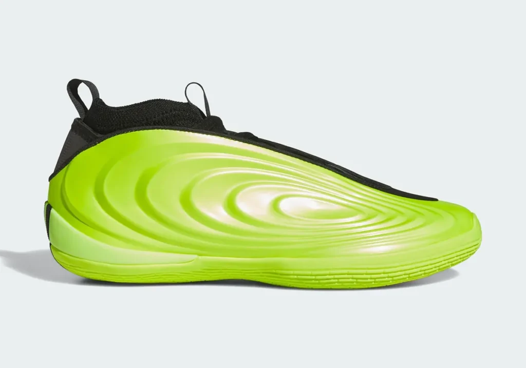A bright green sneaker with a futuristic, wavy design and a black collar.