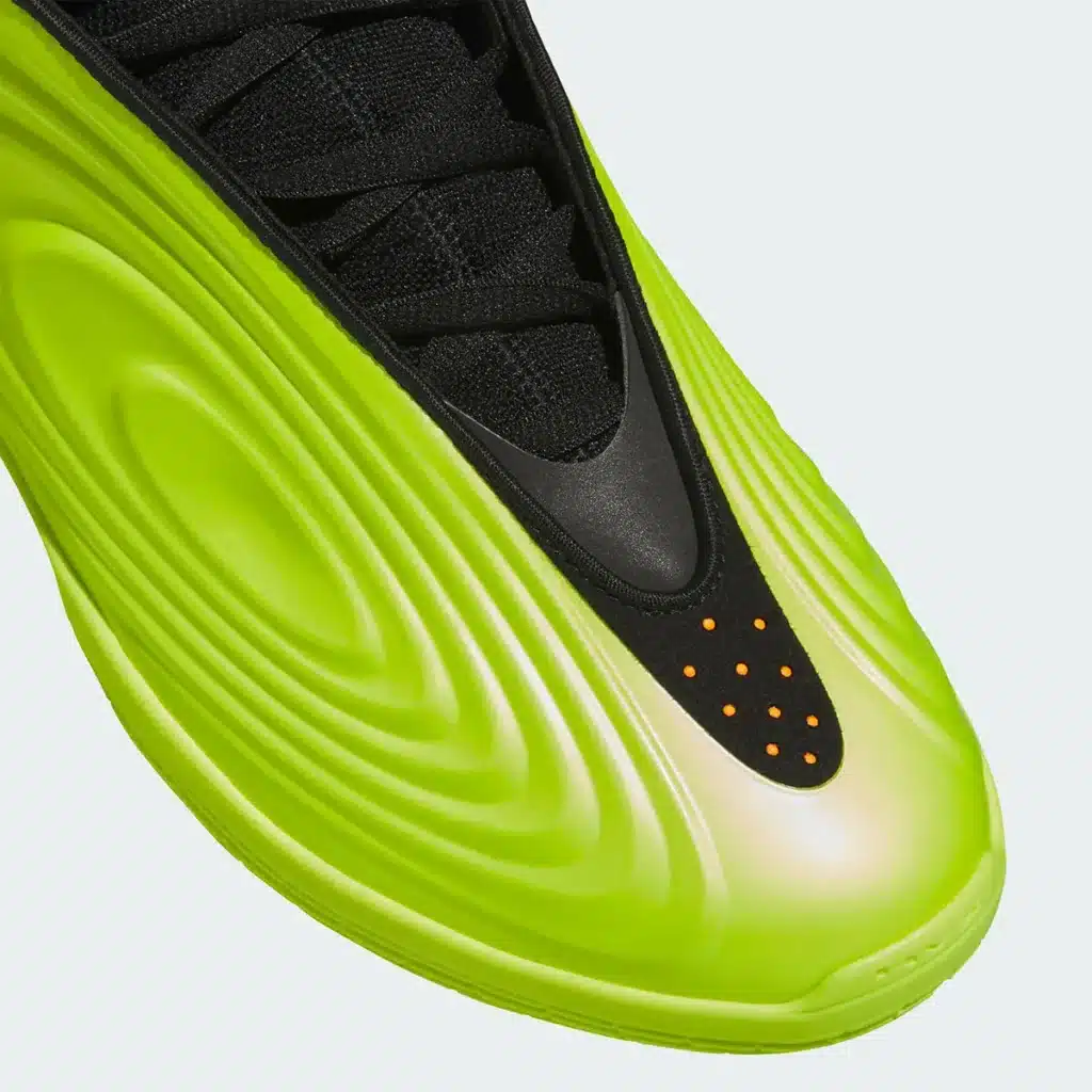 Adidas Harden Vol. 10 “Hi-Res Yellow” sneaker with a futuristic design featuring a wavy pattern and orange dots near the toe.