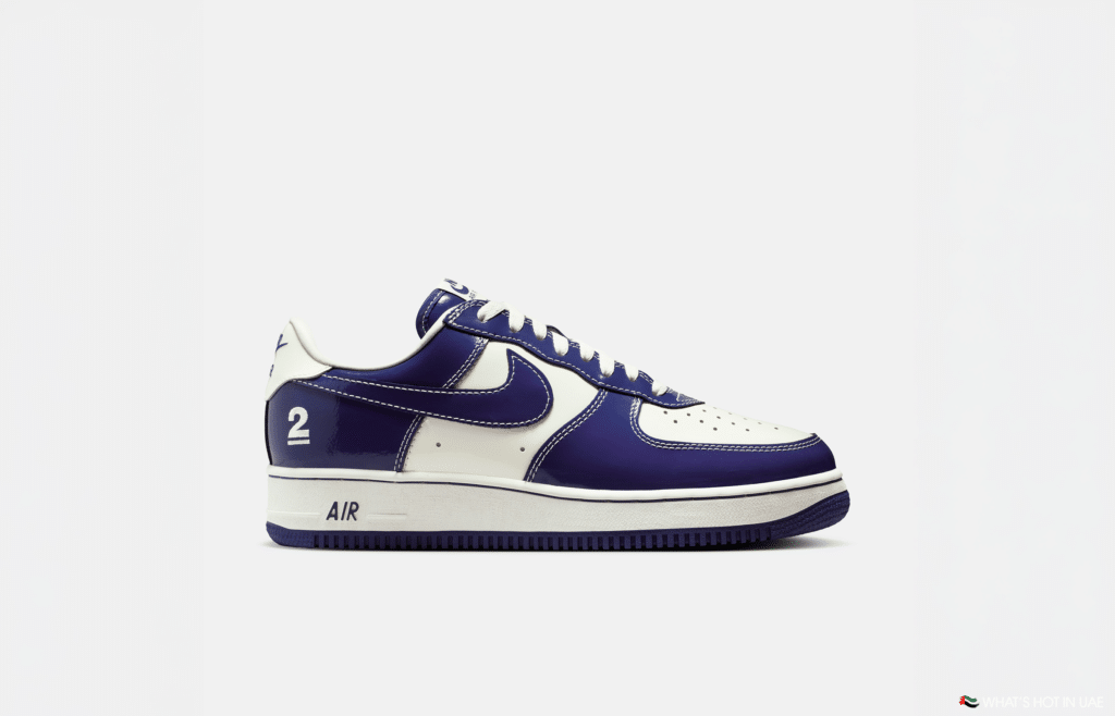 A white and purple sneaker with the number 2 on the heel and "AIR" on the midsole.