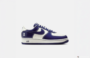 A white and purple sneaker with the number 2 on the heel and "AIR" on the midsole.