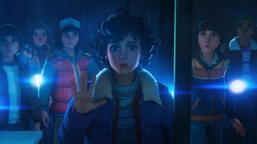 A group of kids with flashlights look concerned, led by a curly-haired child with a raised hand in a dimly lit room.