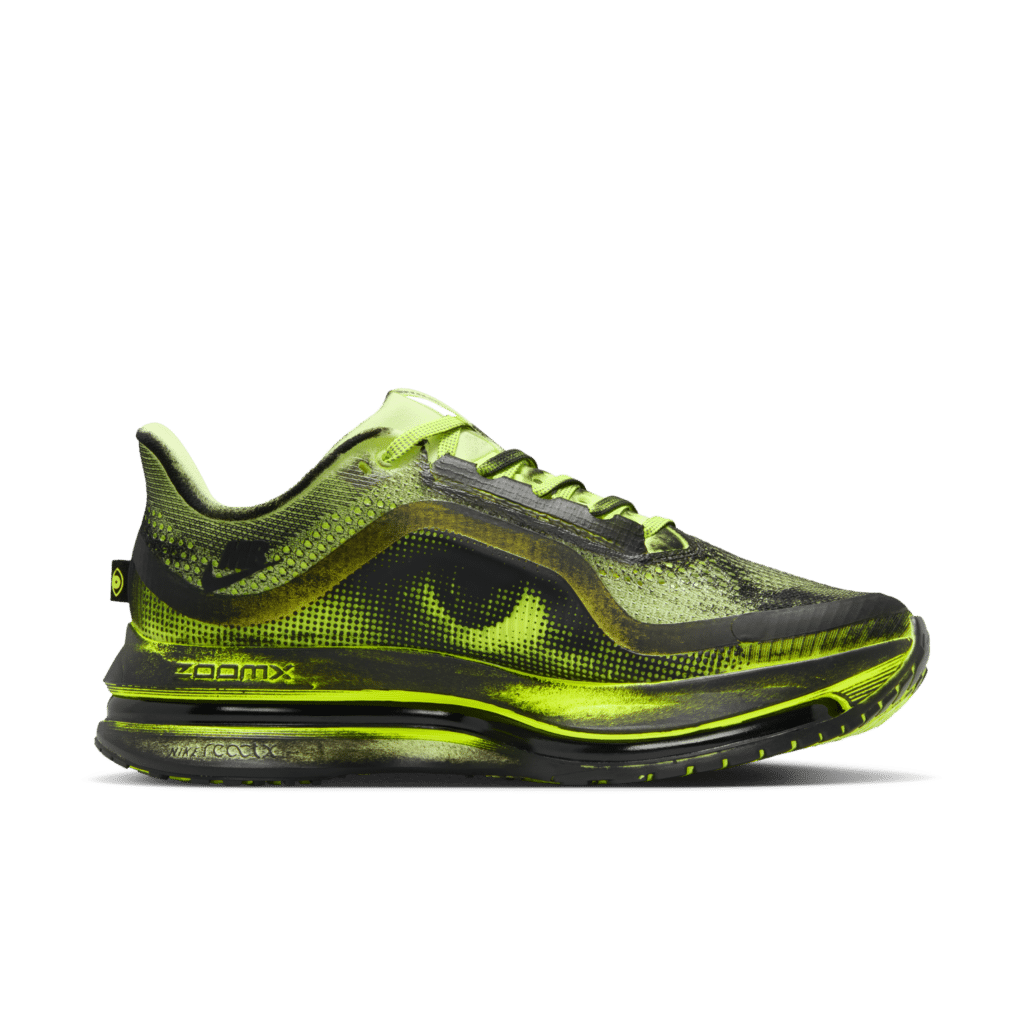 A lime green and black athletic shoe with a sleek design, featuring prominent cushioning and a patterned texture.