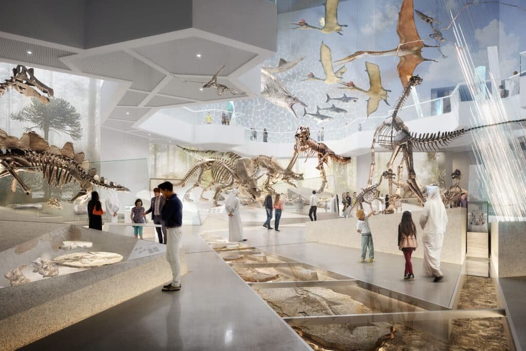 People exploring an Abu Dhabi Free Museum Access exhibit with dinosaur skeletons and fossils on display.
