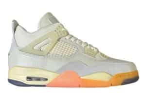 A stylish sneaker featuring a mix of white, cream, and orange tones with a visible air unit and textured leather details.