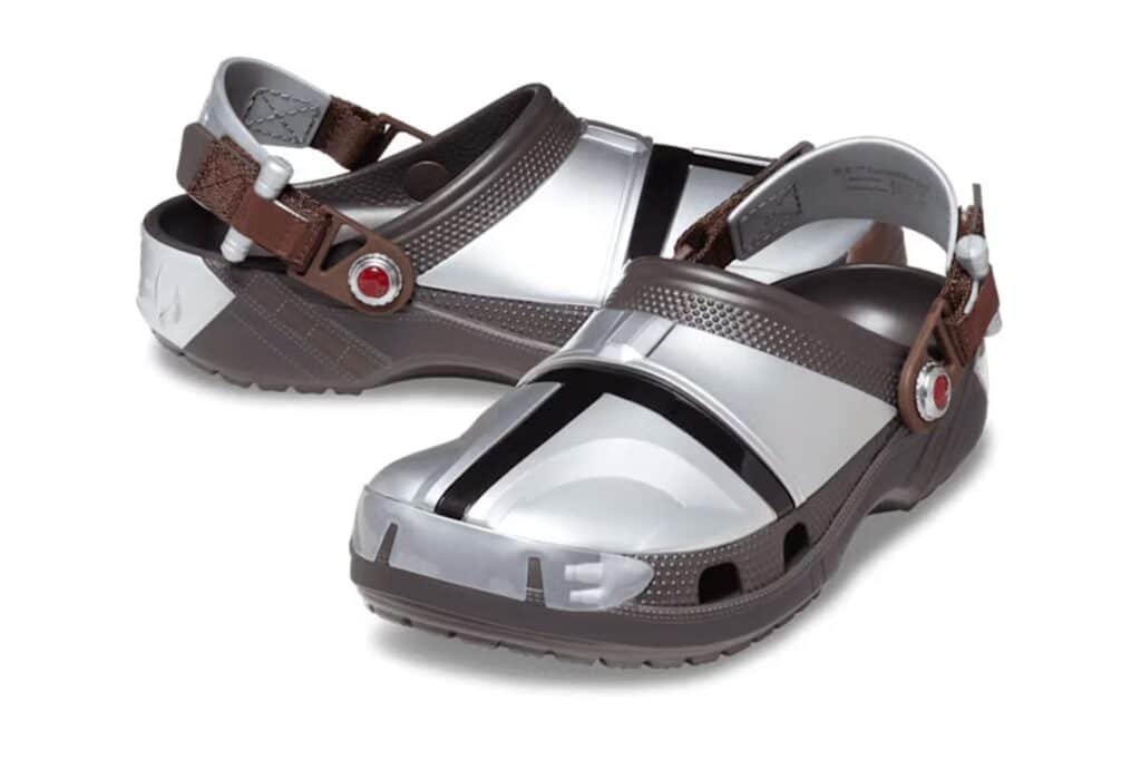 Pairs of silver and brown Star Wars Crocs with adjustable brown straps and distinctive markings on the sides.