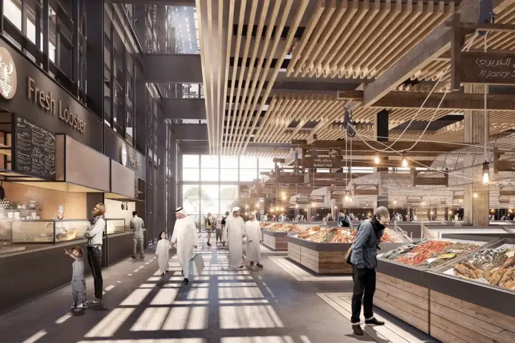 People browse a modern, spacious indoor market with wooden ceilings, light-filled space, and various food stalls.