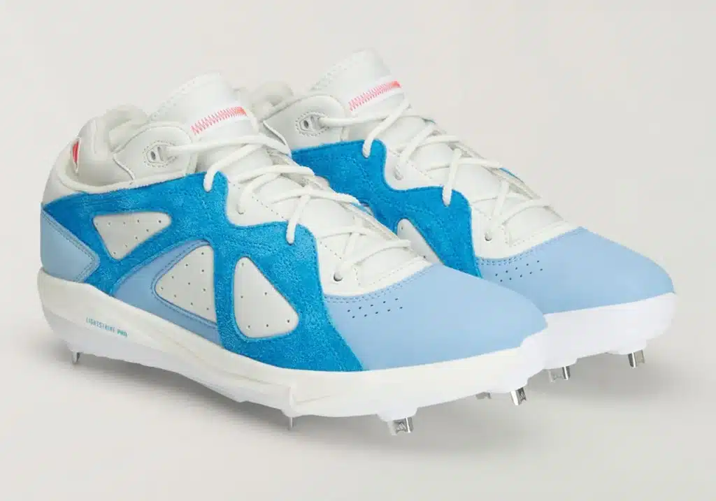 Pair of white and blue athletic spikes with cleats, shown on a plain background