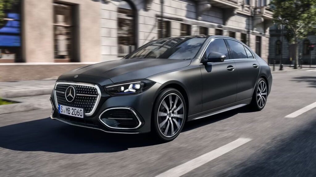 2027 Mercedes-Benz C-Class: The EV-inspired facelift for petrol lovers Dark Mercedes-Benz sedan driving on a city street