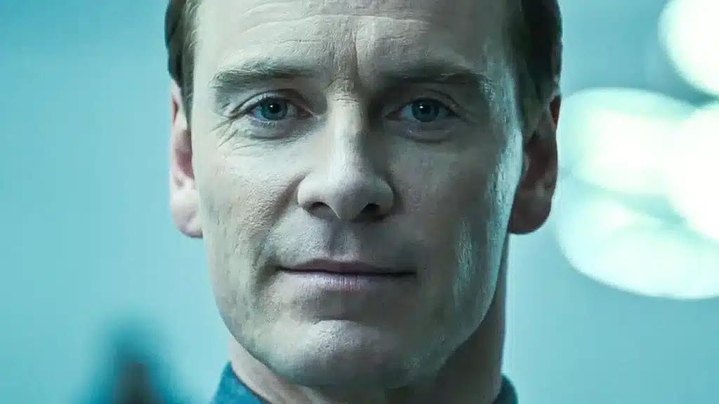 Ridley Scott confirms third Alien prequel starring Michael Fassbender Close-up portrait of a serious-looking man with blue eyes, lit by cool blue light