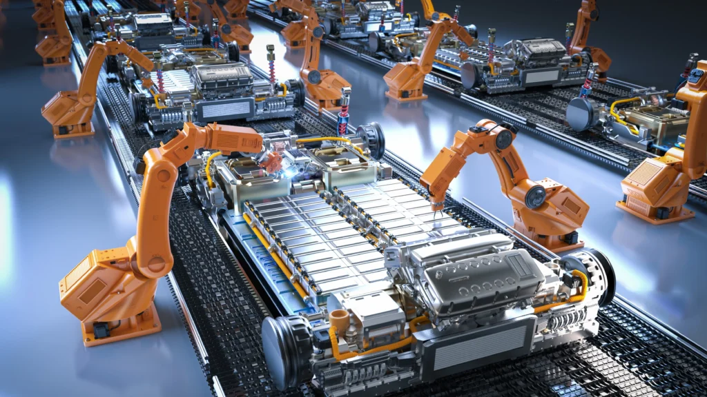 Robotic arms assemble electric vehicle battery packs on an automated factory production line