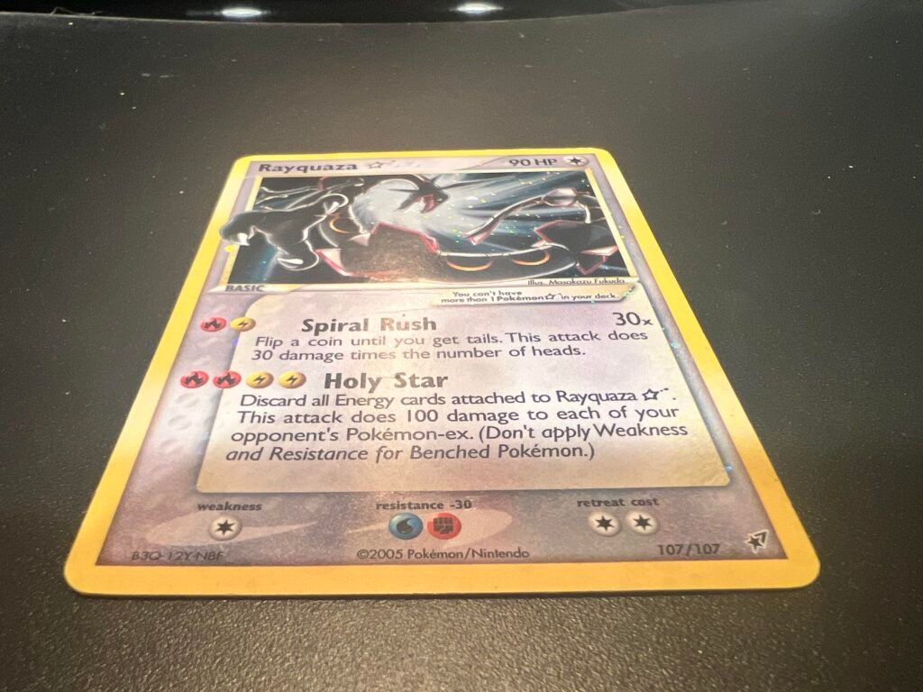 A Pokémon trading card featuring Rayquaza, with 90 HP and the attacks Spiral Rush and Holy Star